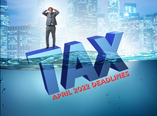 Upset man standing on huge tax letters