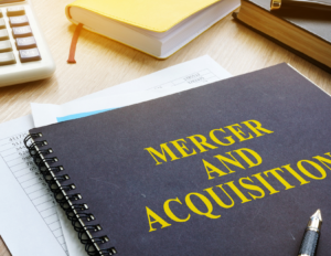 Binder with the words Merger and Acquisitions on it