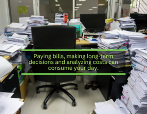 cluttered office with stacks of papers